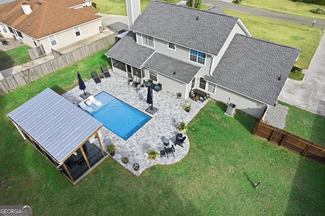 a view of a swimming pool with a patio