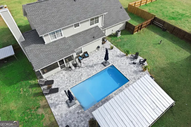 a view of a house with a swimming pool