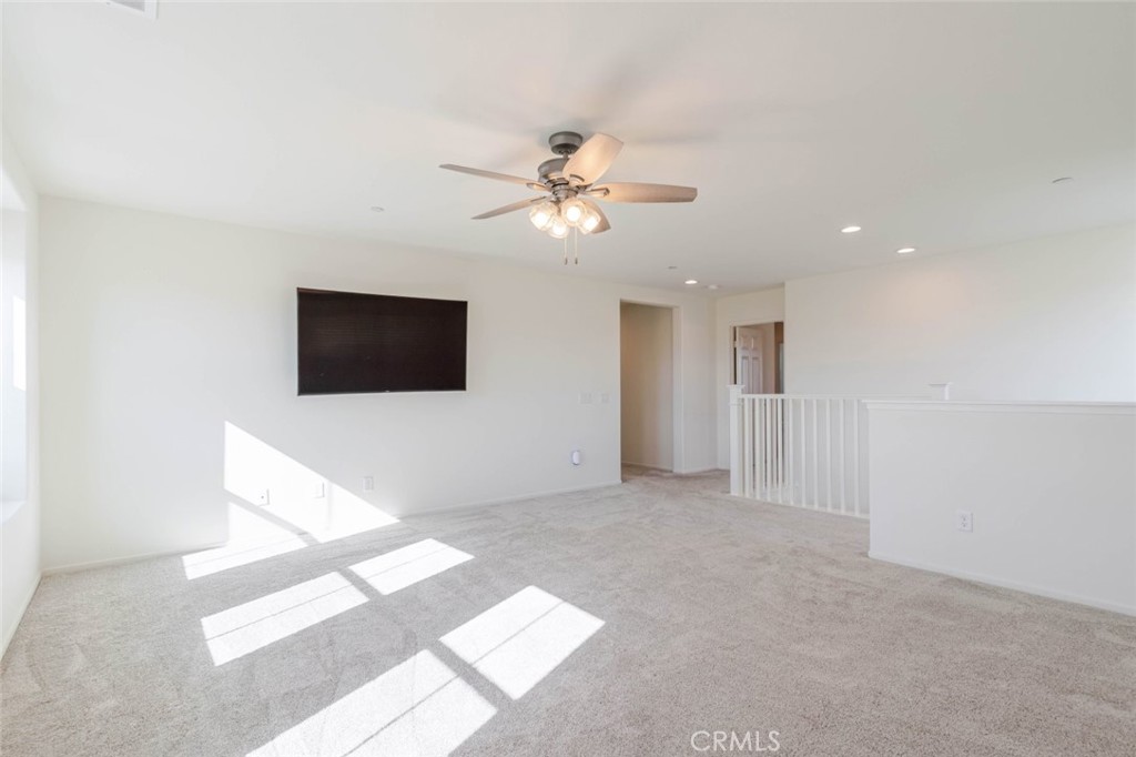 2133 East Kettering Street Lancaster, CA 93535 - Photo 14 of 32 a view of a livingroom with a flat screen tv