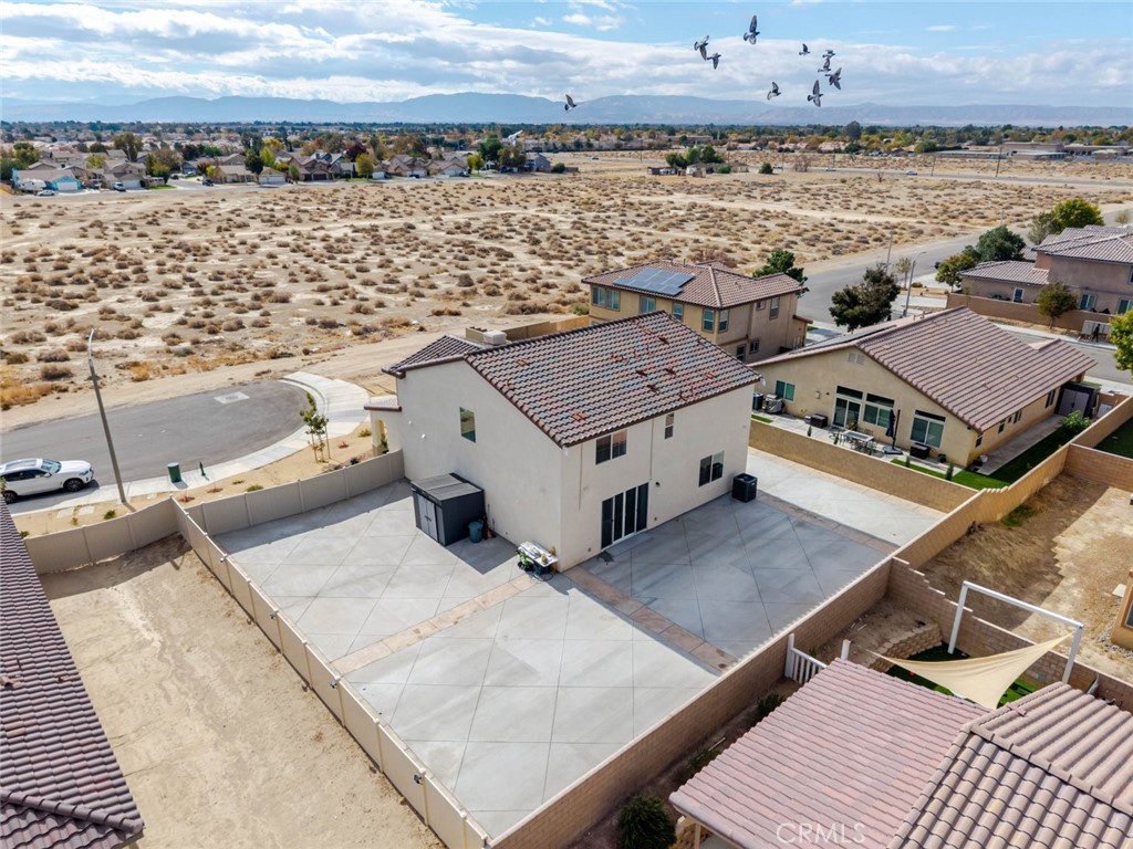 2133 East Kettering Street Lancaster, CA 93535 - Photo 27 of 32 an aerial view of a house with a ocean