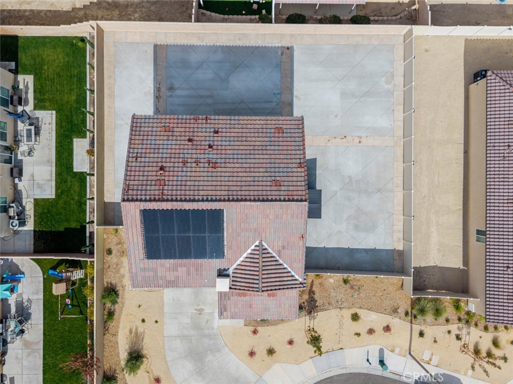 2133 East Kettering Street Lancaster, CA 93535 - Photo 28 of 32 a front view of a house with chairs