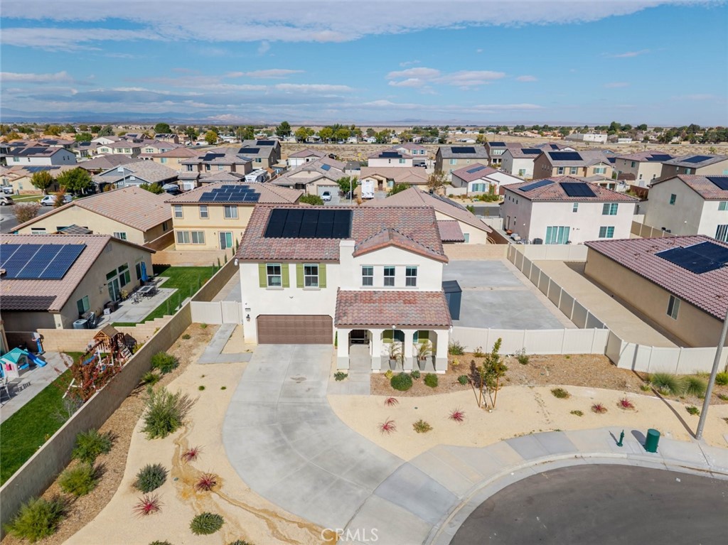 2133 East Kettering Street Lancaster, CA 93535 - Photo 29 of 32 an aerial view of a building with parking