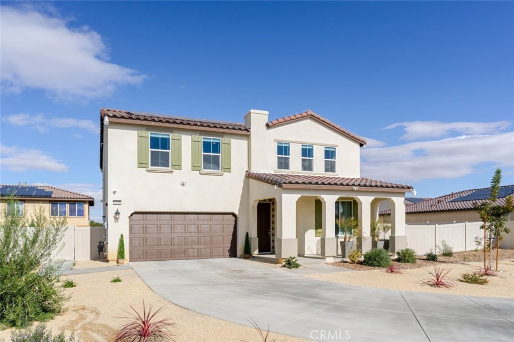 2133 East Kettering Street Lancaster, CA 93535 - Photo 31 of 32 a front view of a house with yard