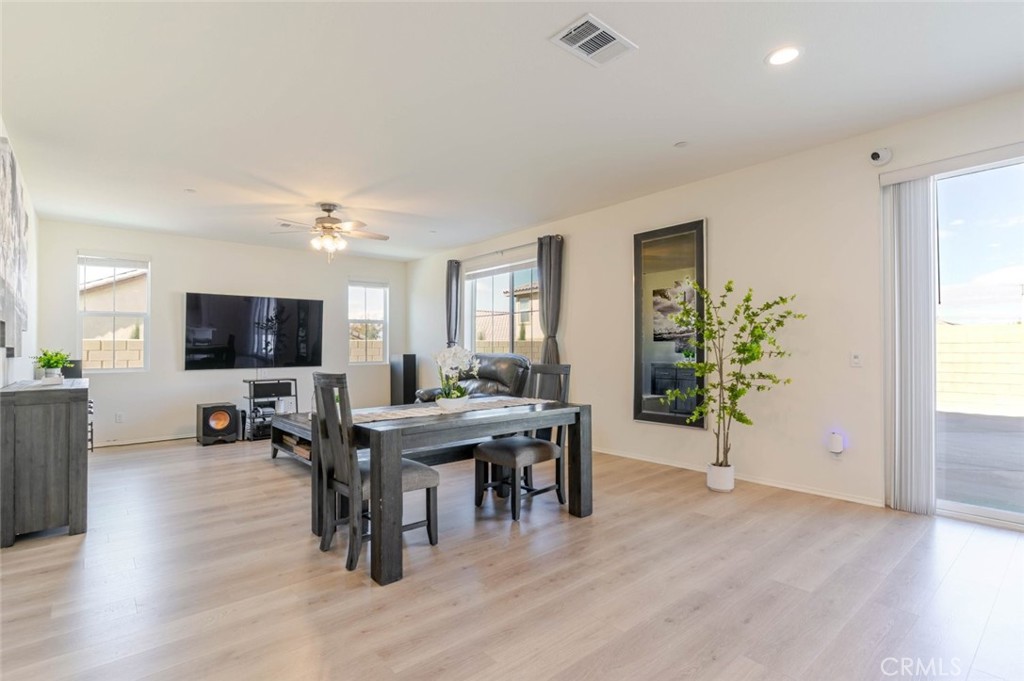 2133 East Kettering Street Lancaster, CA 93535 - Photo 10 of 32 a living room with furniture and a flat screen tv