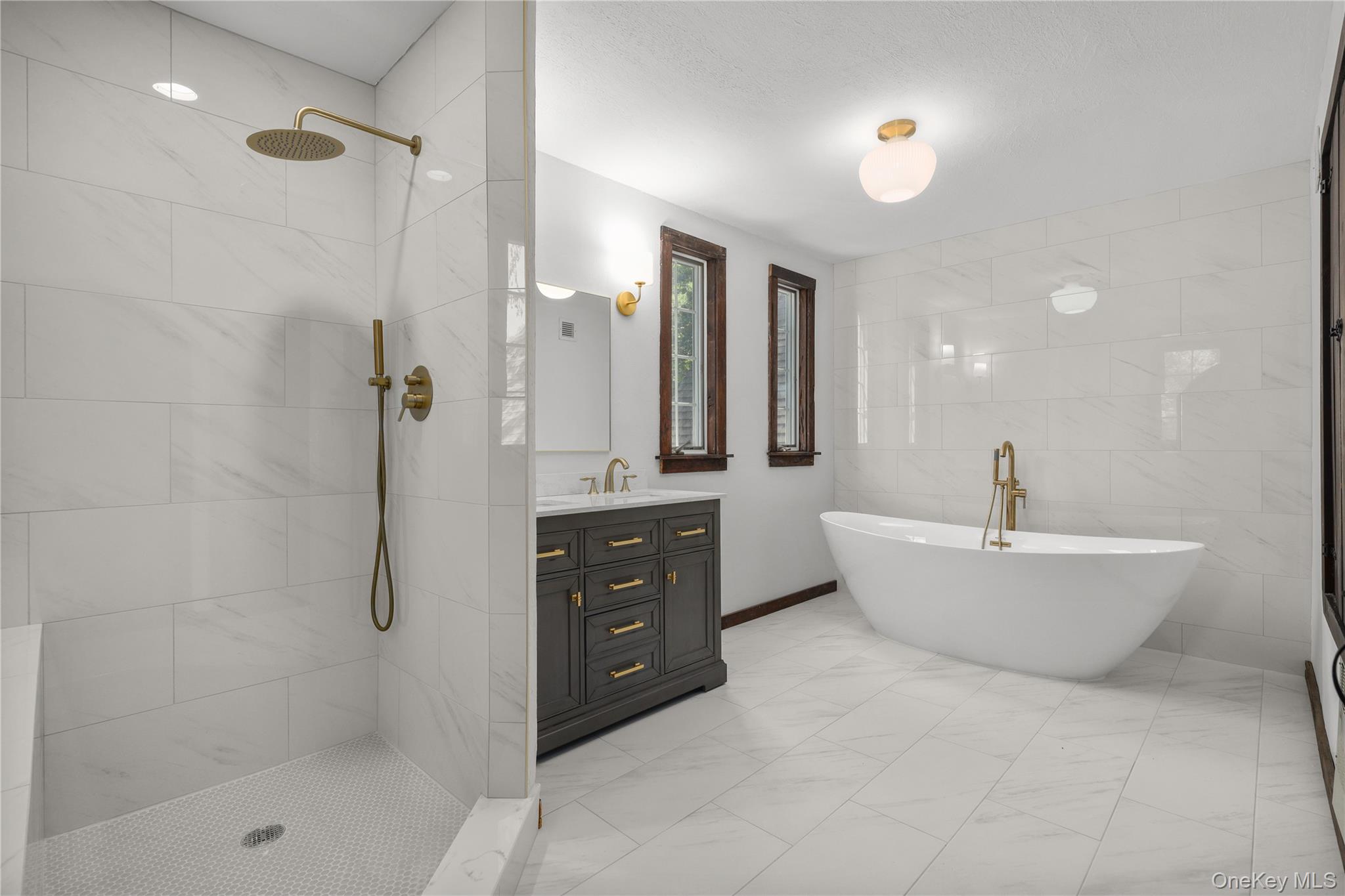 160 Long Ridge Road Bedford, NY 10506 - Photo 10 of 25 a spacious bathroom with a tub sink shower and mirror