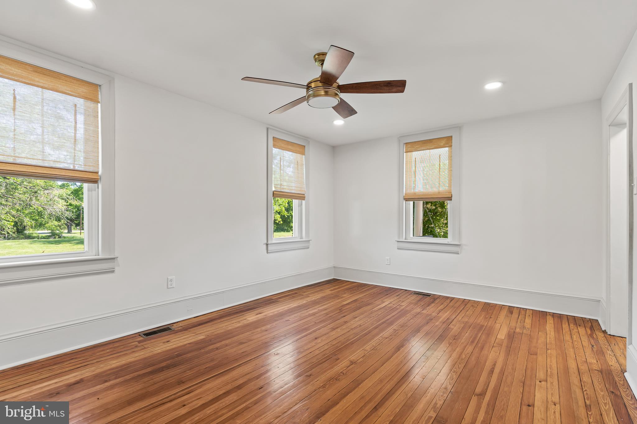 14005 Dry Run Road Clear Spring, MD 21722 - Photo 26 of 44 a view of empty room with wooden floor and fan