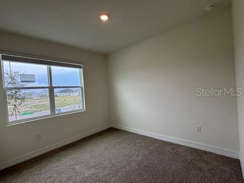 3974 Kennebunk Loop Mount Dora, FL 32757 - Photo 11 of 14 an empty room with a window
