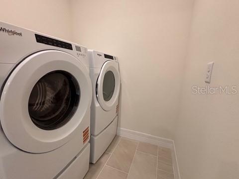 3974 Kennebunk Loop Mount Dora, FL 32757 - Photo 13 of 14 a utility room with dryer and washer