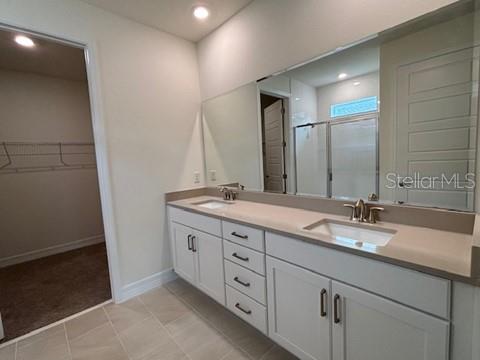 3974 Kennebunk Loop Mount Dora, FL 32757 - Photo 7 of 14 a bathroom with double sink and a mirror