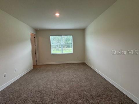 3974 Kennebunk Loop Mount Dora, FL 32757 - Photo 9 of 14 an empty room with a window