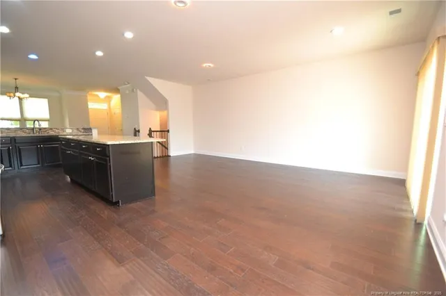 a kitchen with stainless steel appliances granite countertop a stove and a sink