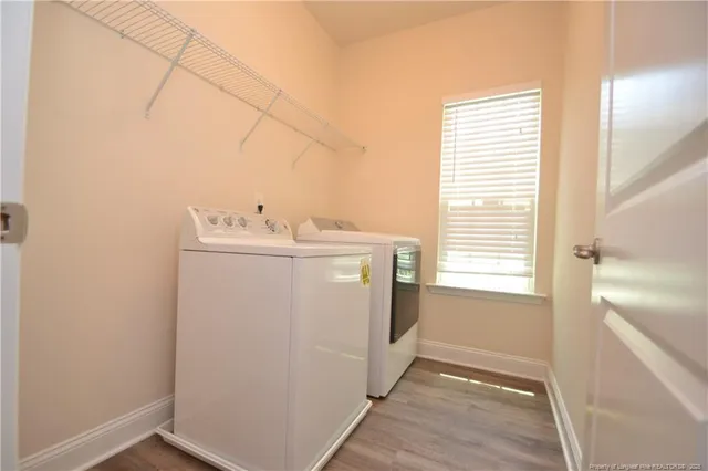 a utility room with closet dryer and washer