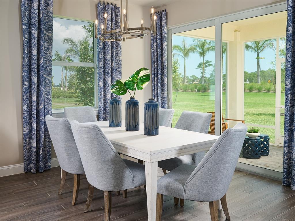 392 Birkdale Drive Daytona Beach, FL 32124 - Photo 4 of 6 a view of a dining room with furniture window and wooden floor