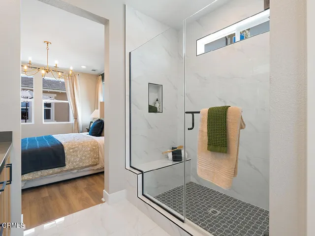 a bedroom with a bed and a walk in closet