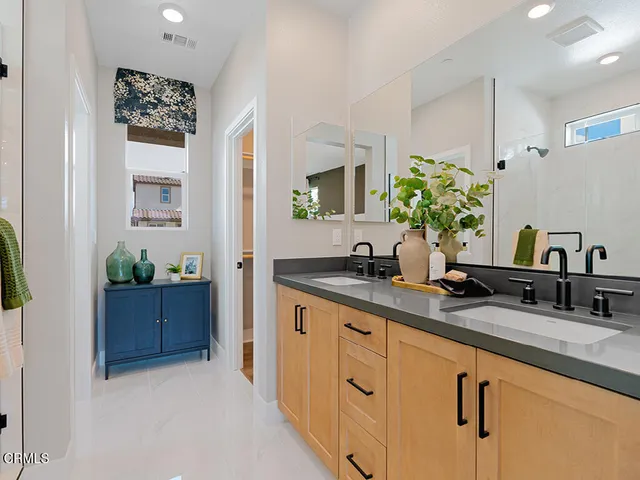 a bathroom with a sink and mirror