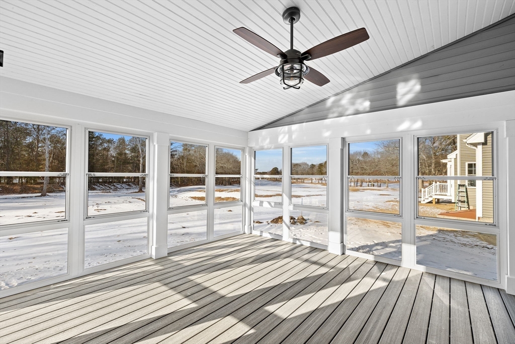 6 Beacon Street, Unit 79 Onset, MA 02558 - Photo 7 of 13 a view of a room with wooden floor and balcony