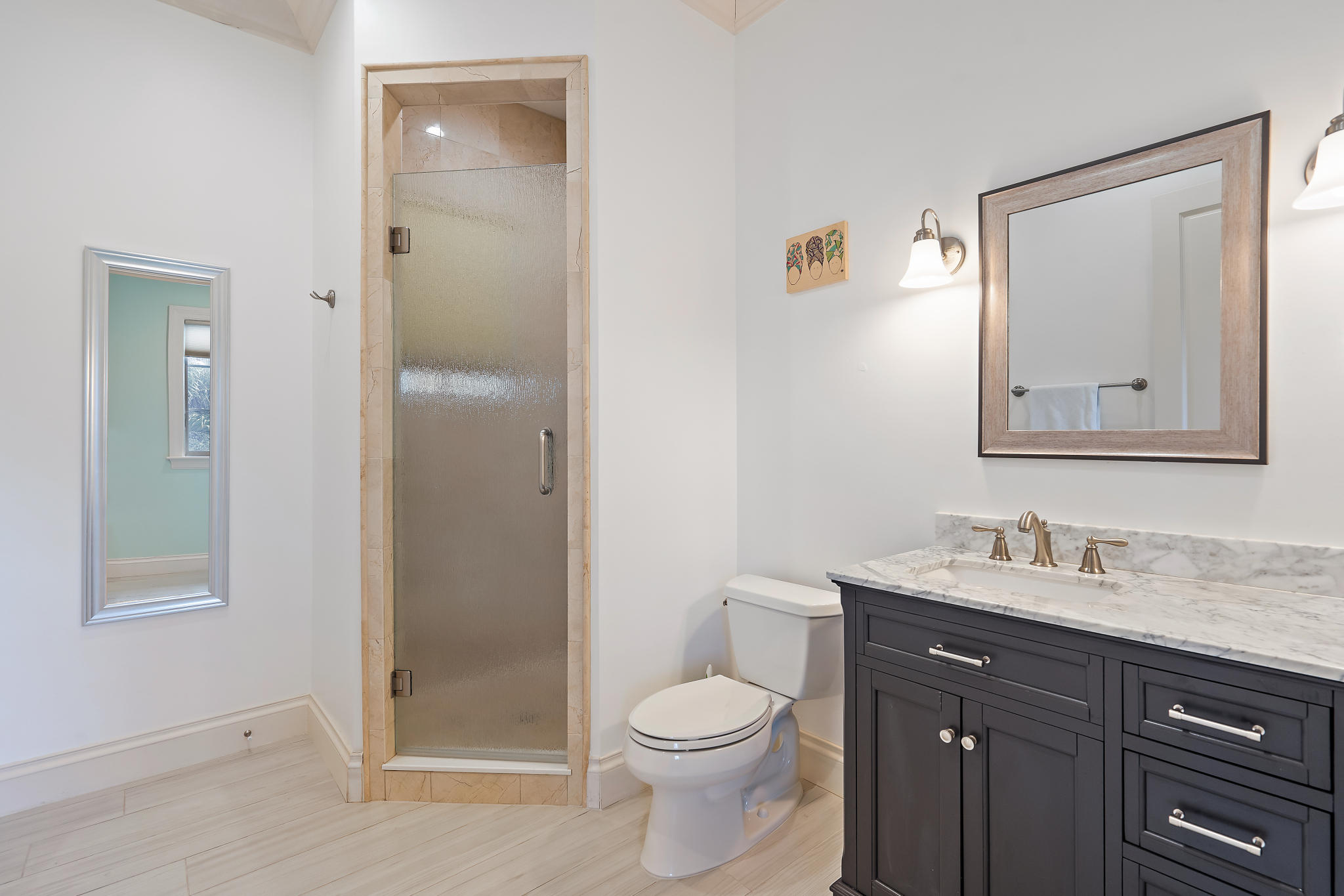 426 Red Hawk Drive Jupiter, FL 33477 - Photo 23 of 40 a bathroom with a toilet sink vanity and shower