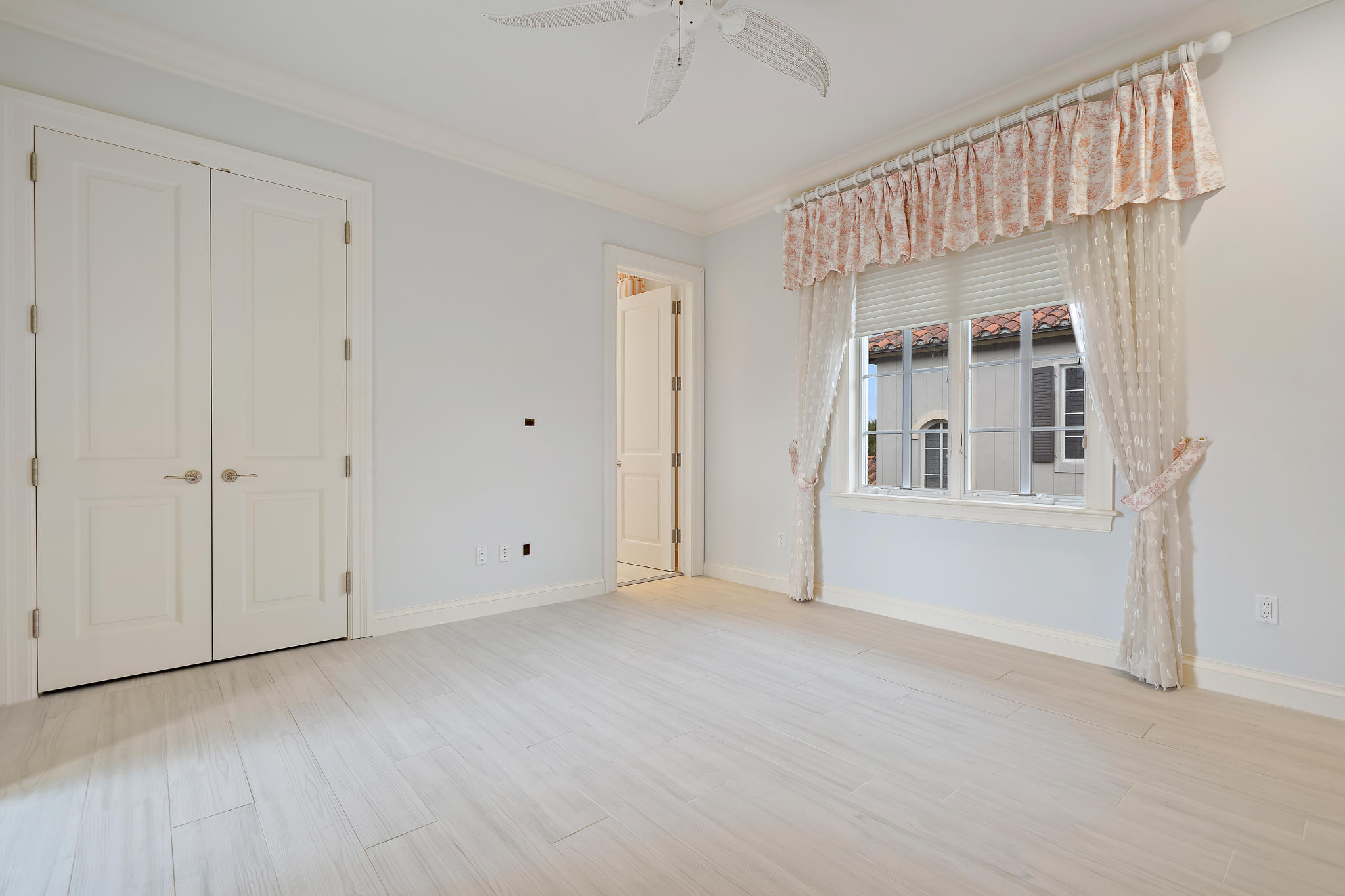 426 Red Hawk Drive Jupiter, FL 33477 - Photo 25 of 40 a view of an empty room with a window