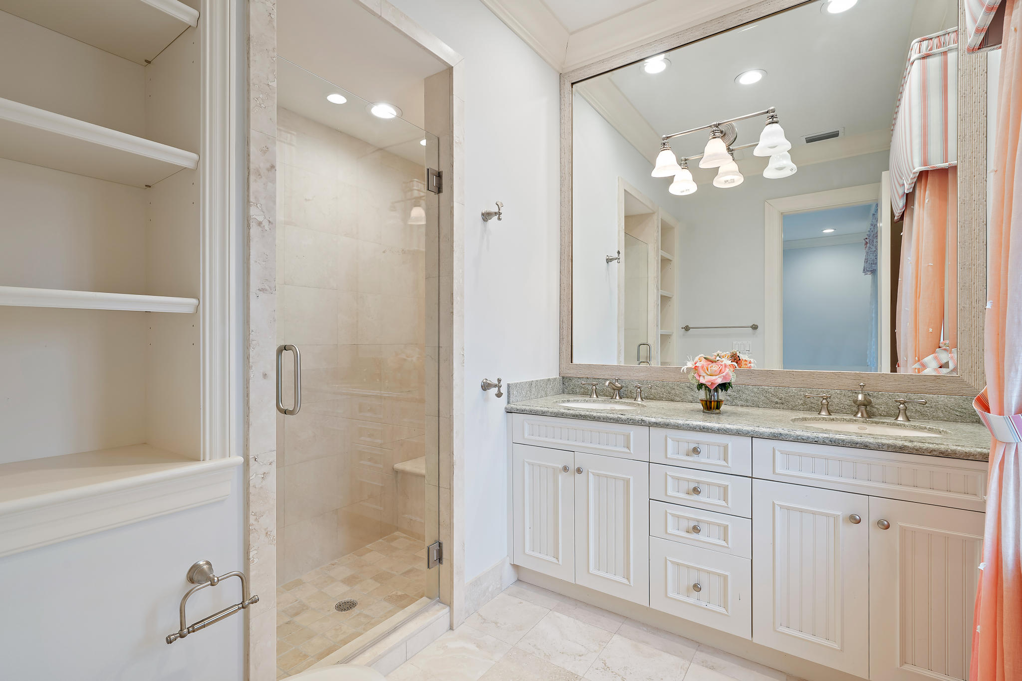 426 Red Hawk Drive Jupiter, FL 33477 - Photo 26 of 40 a bathroom with a granite countertop sink a large mirror and shower