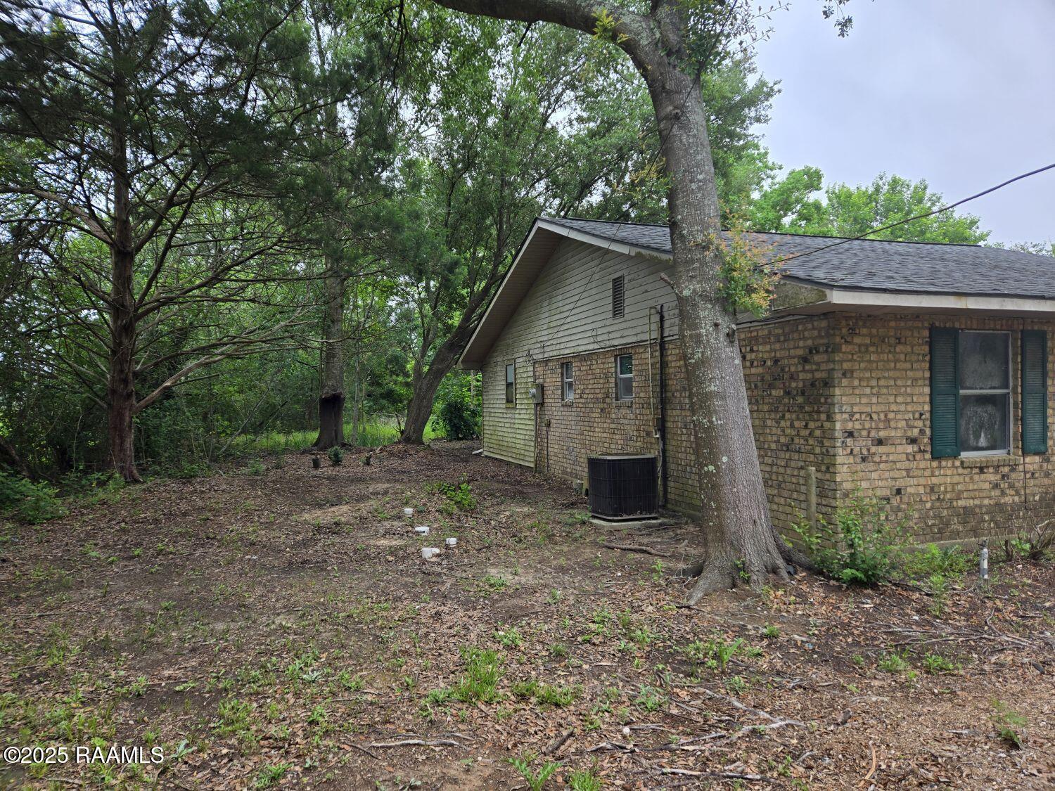 1716 Woodstone Road Eunice, LA 70535 - Photo 18 of 23 18 LEFT SIDE