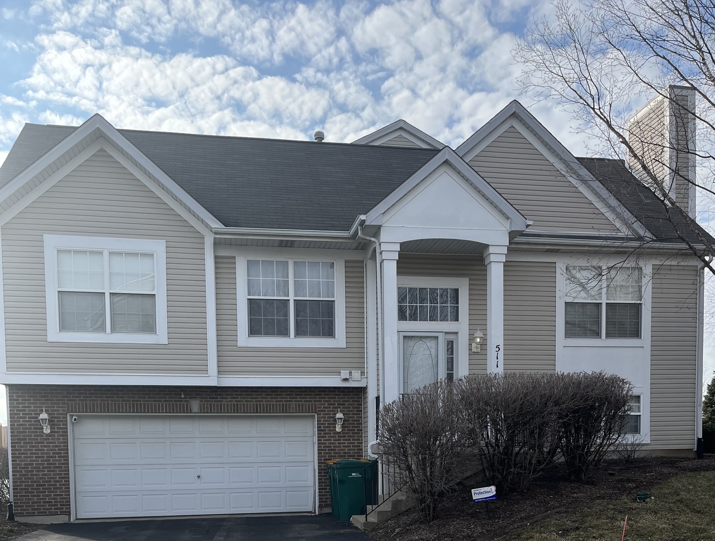 511 Silver Leaf Drive Joliet, IL 60431 - Photo 1 of 1 a front view of a house with garden