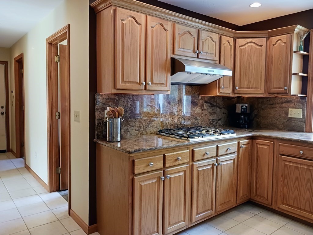 6 Winn Road Nashua, NH 03062 - Photo 11 of 33 a kitchen with stainless steel appliances granite countertop a refrigerator and a sink