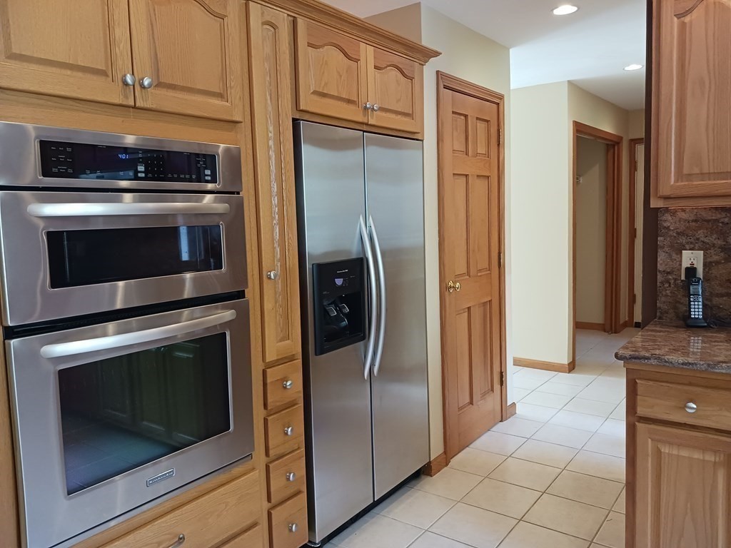 6 Winn Road Nashua, NH 03062 - Photo 12 of 33 a kitchen with stainless steel appliances granite countertop a refrigerator and a stove