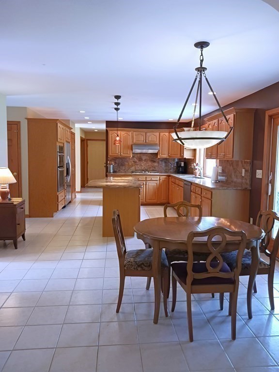 6 Winn Road Nashua, NH 03062 - Photo 15 of 33 a view of a dining room with furniture