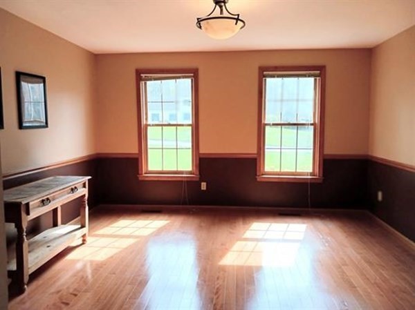 6 Winn Road Nashua, NH 03062 - Photo 16 of 33 a view of an empty room with a window and wooden floor