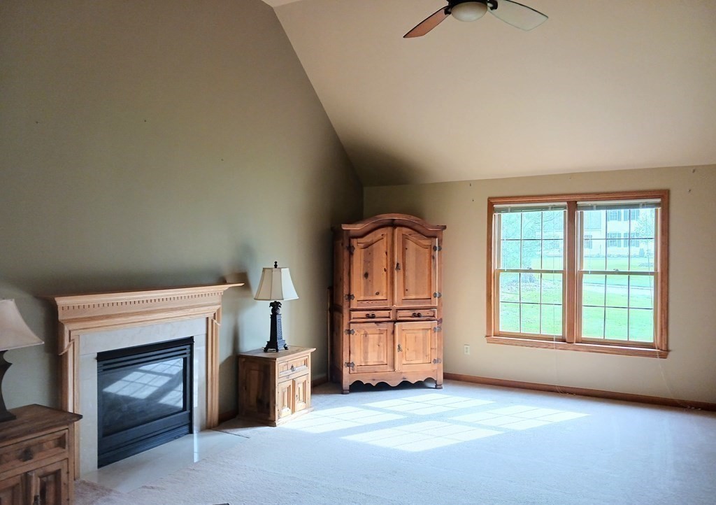 6 Winn Road Nashua, NH 03062 - Photo 19 of 33 an empty room with furniture and a fireplace