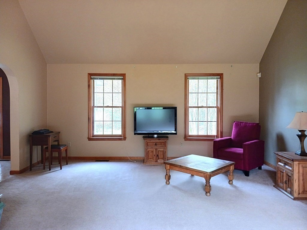 6 Winn Road Nashua, NH 03062 - Photo 20 of 33 a living room with furniture a air conditioner vent and a window