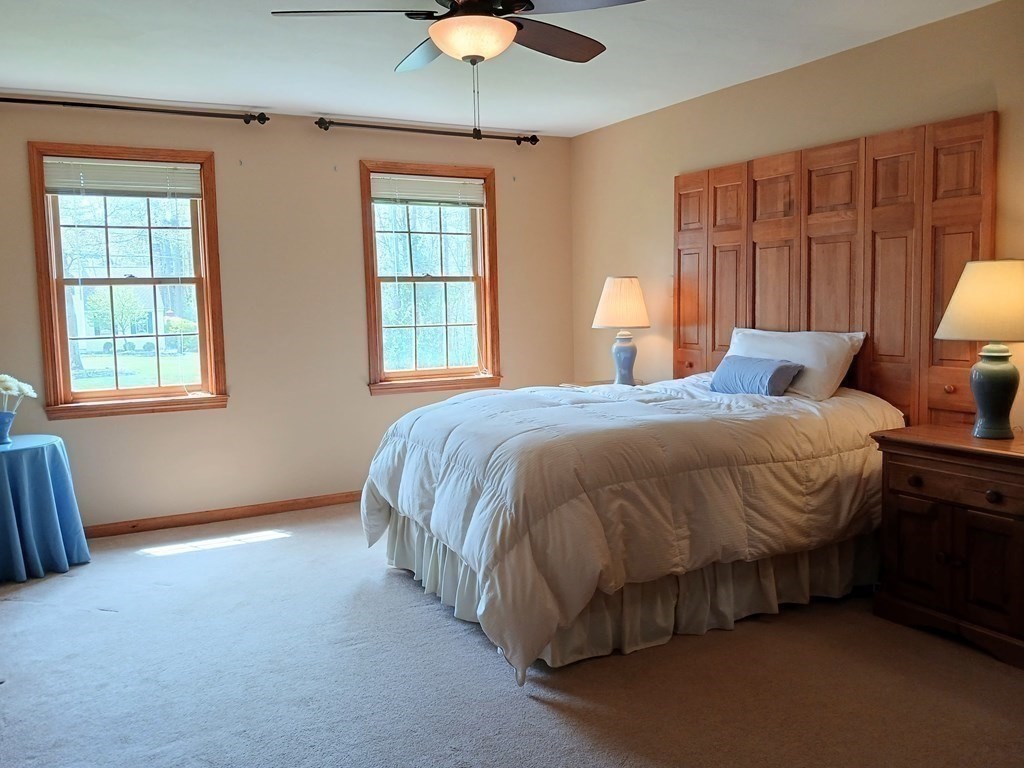 6 Winn Road Nashua, NH 03062 - Photo 22 of 33 a spacious bedroom with a bed and a window