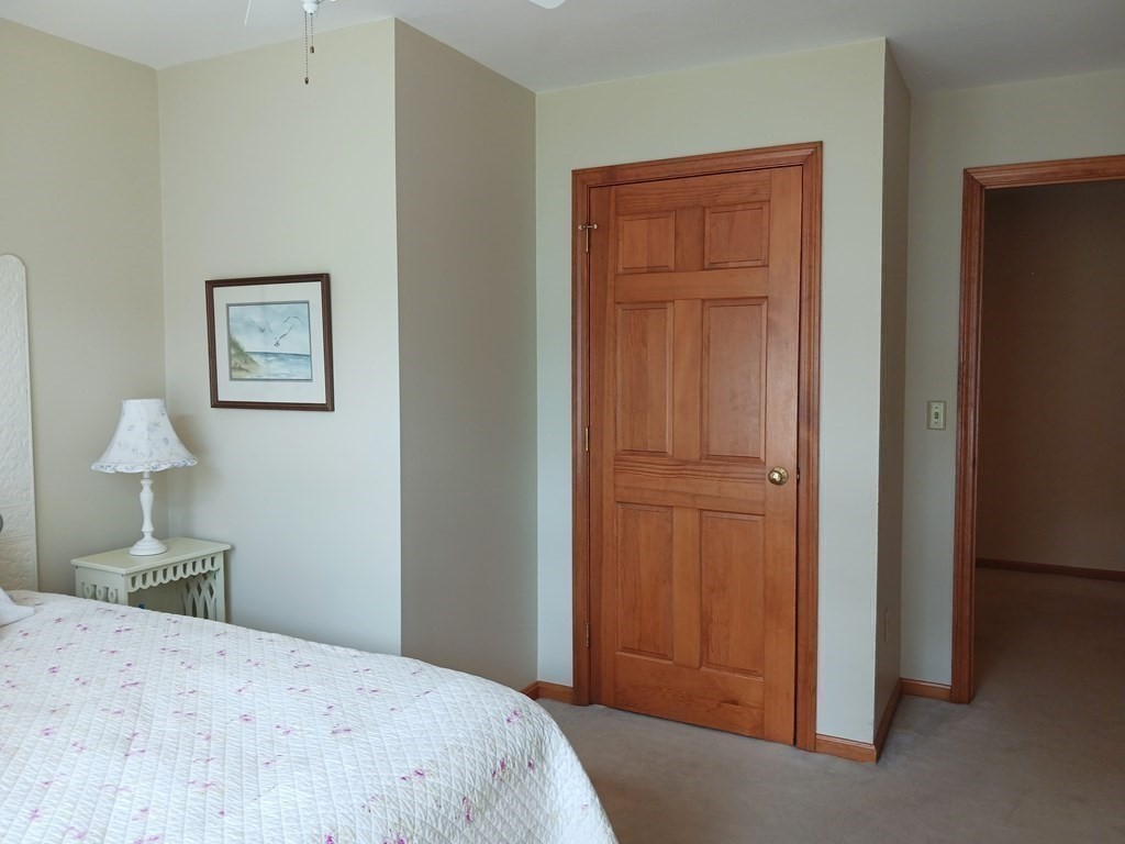 6 Winn Road Nashua, NH 03062 - Photo 26 of 33 a bedroom with a bed and a painting on the wall
