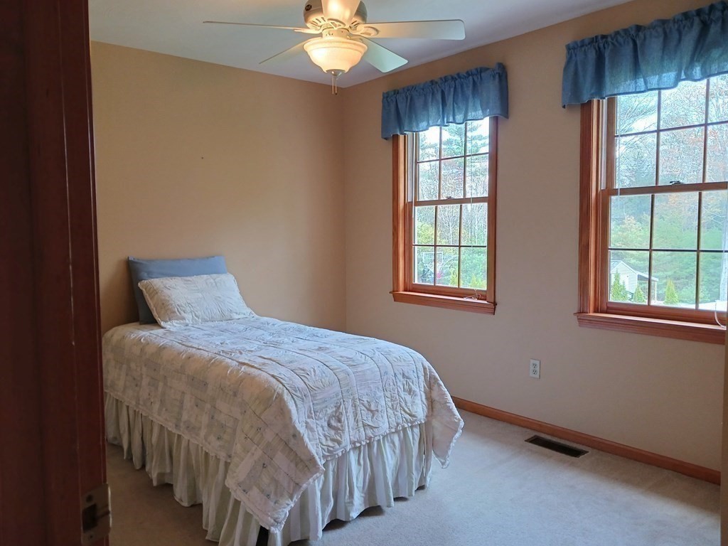 6 Winn Road Nashua, NH 03062 - Photo 30 of 33 a bedroom with a bed and window