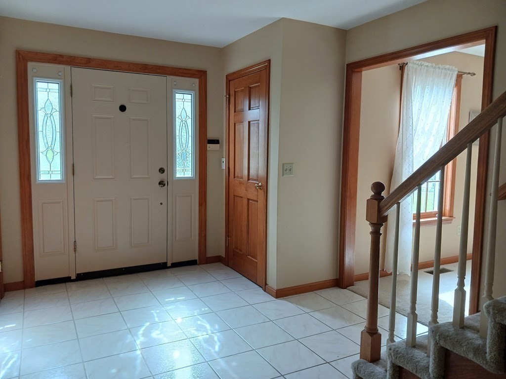 6 Winn Road Nashua, NH 03062 - Photo 7 of 33 a view of an entryway with stairs
