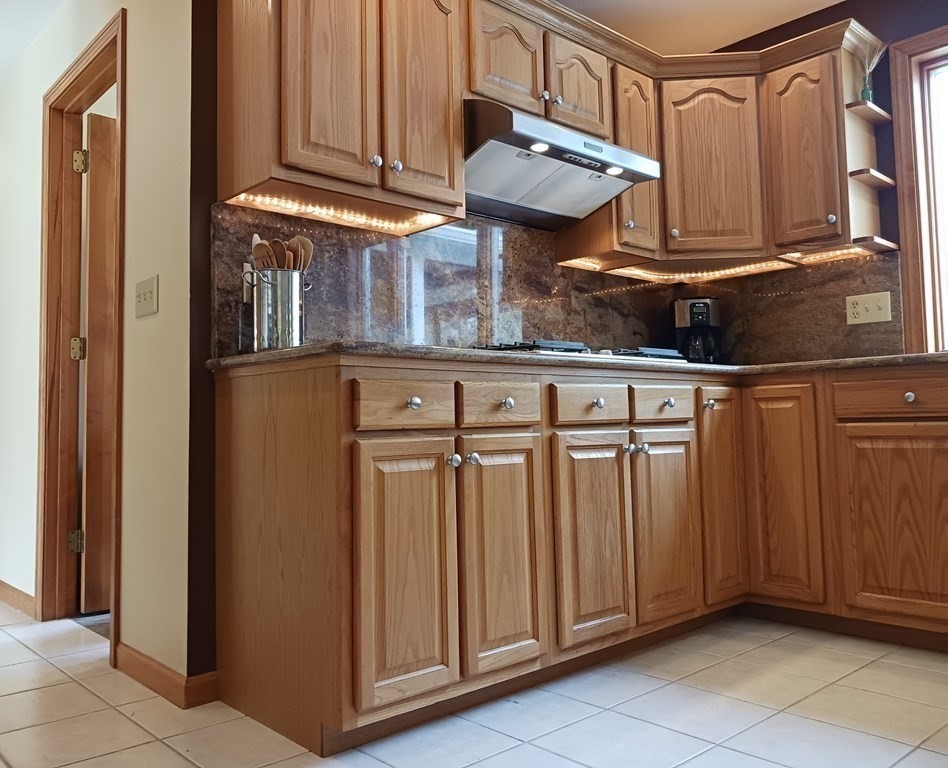 6 Winn Road Nashua, NH 03062 - Photo 10 of 33 a view of a refrigerator and cabinets