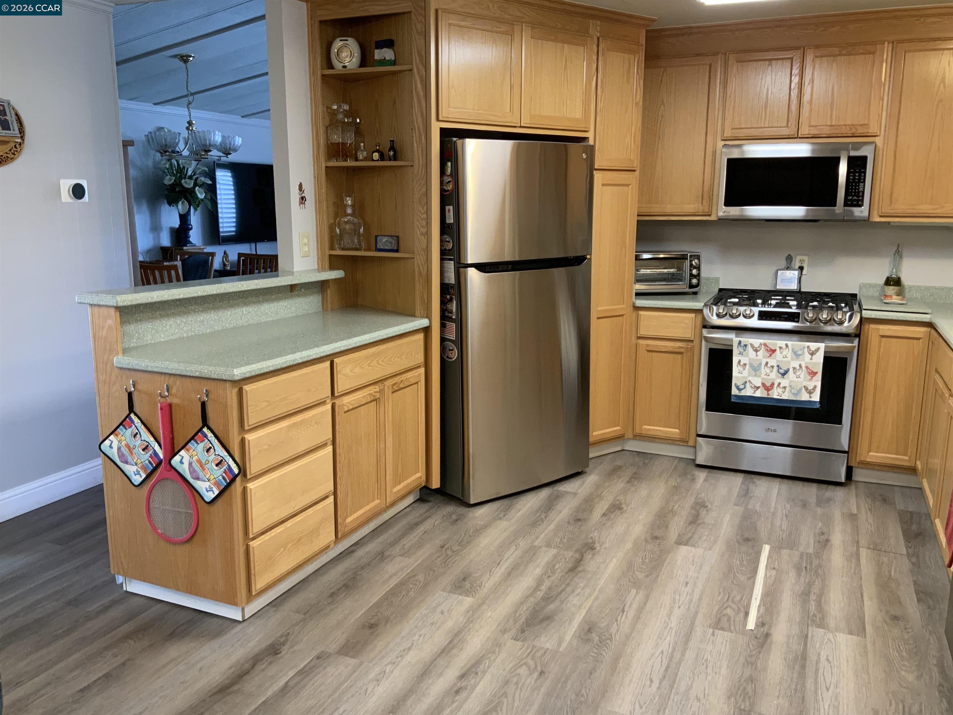238 Aloha Pittsburg, CA 94565 - Photo 12 of 42 a kitchen with stainless steel appliances a stove a refrigerator and a microwave