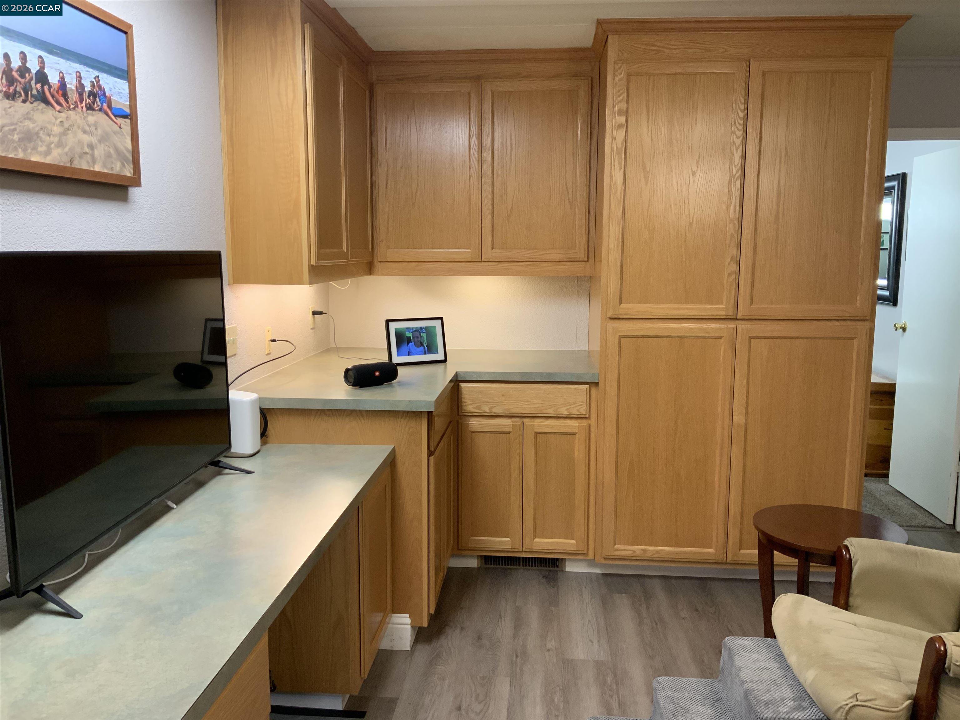 238 Aloha Pittsburg, CA 94565 - Photo 13 of 42 a kitchen with stainless steel appliances a refrigerator and wooden cabinets