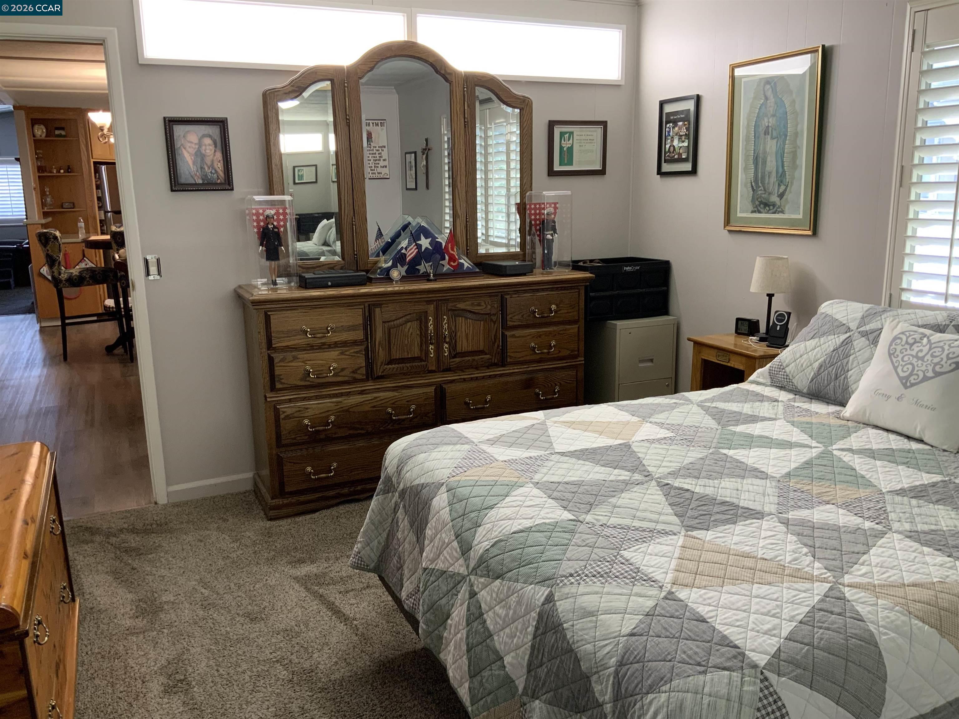 238 Aloha Pittsburg, CA 94565 - Photo 15 of 42 a bedroom with a bed and a dresser