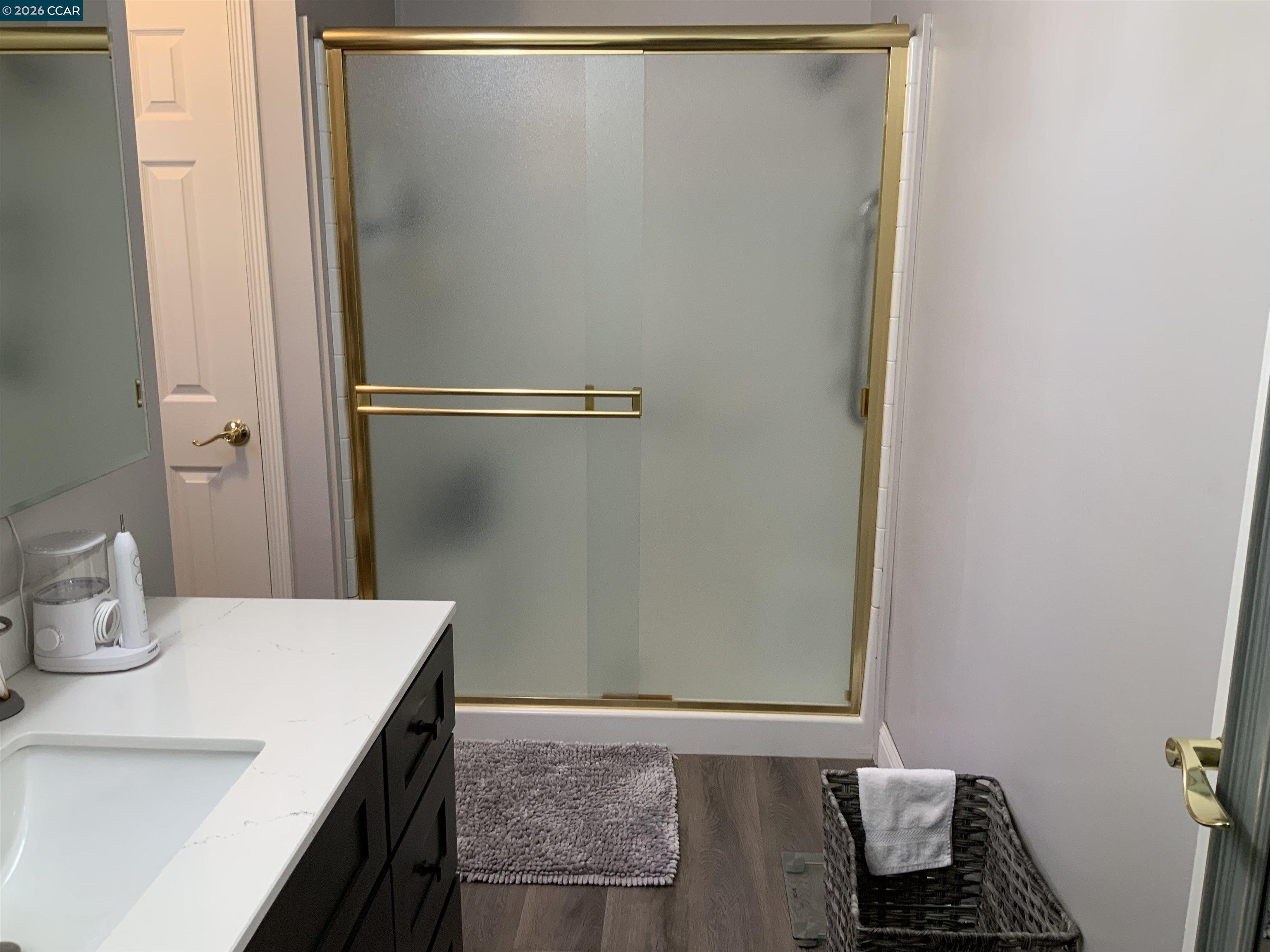 238 Aloha Pittsburg, CA 94565 - Photo 17 of 42 a bathroom with a sink and a mirror