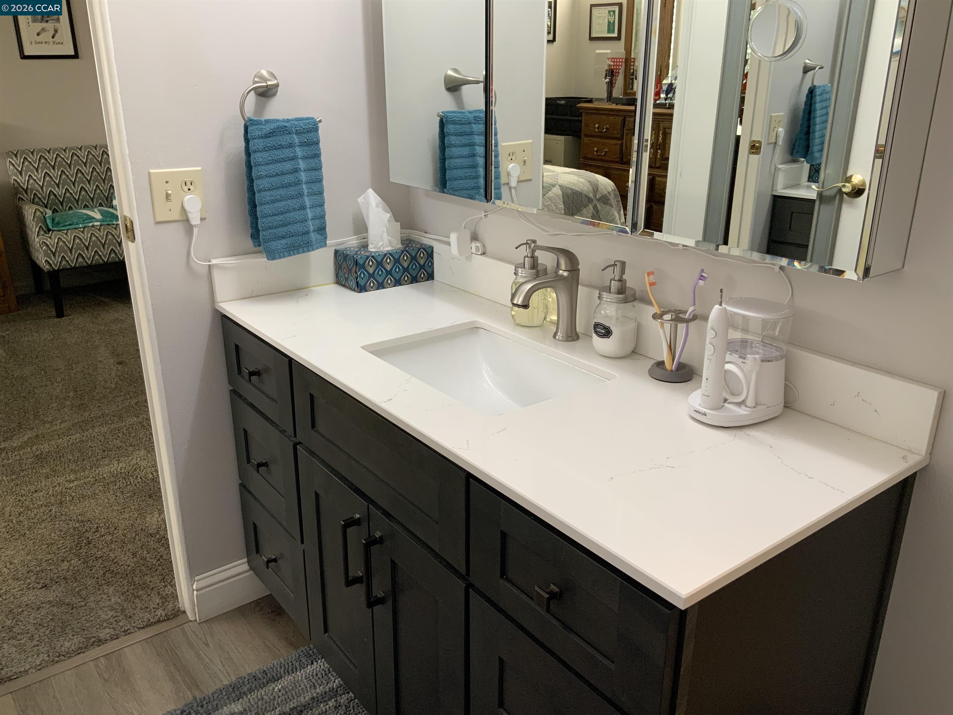 238 Aloha Pittsburg, CA 94565 - Photo 19 of 42 a bathroom with a sink and a mirror