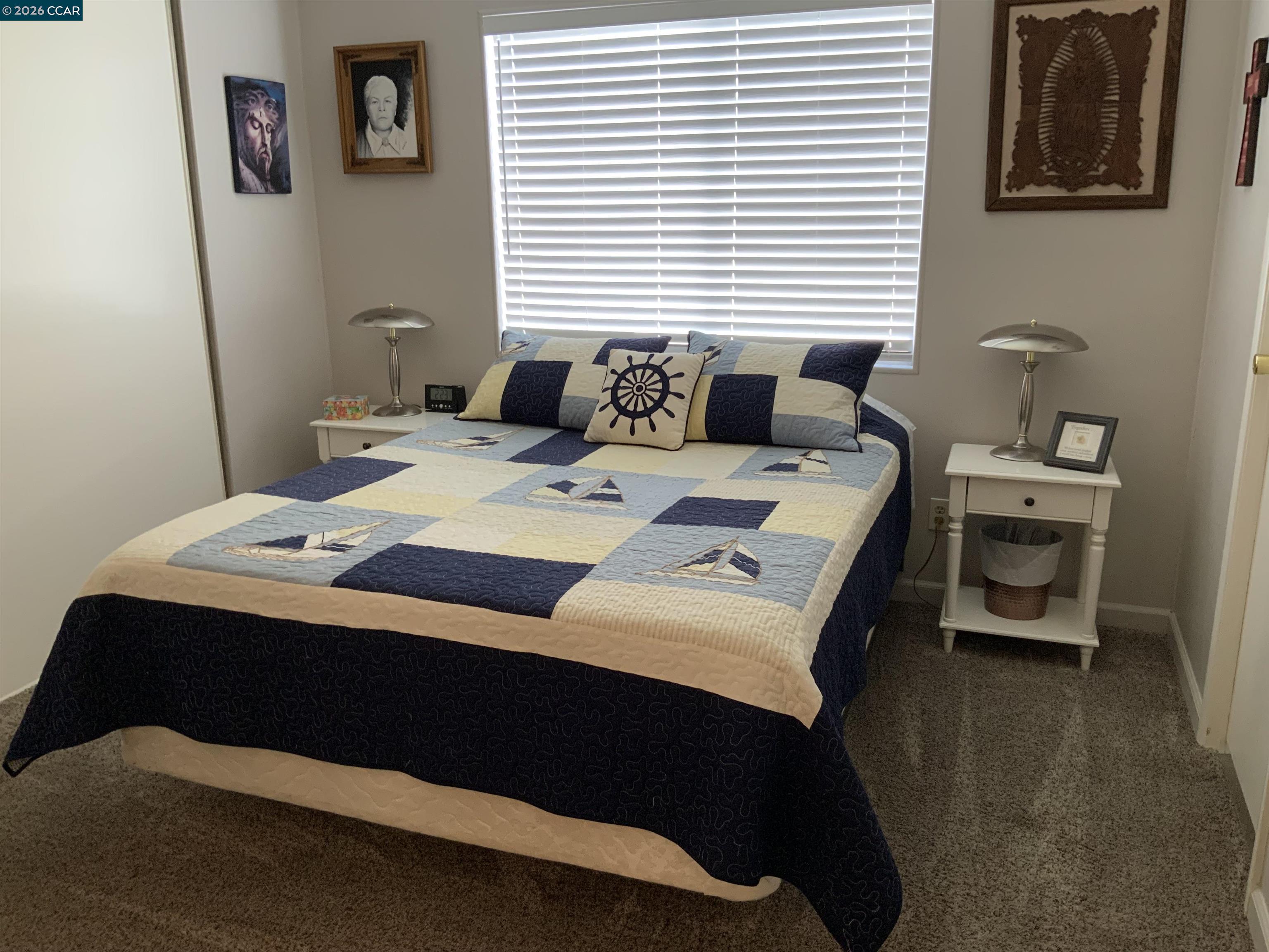 238 Aloha Pittsburg, CA 94565 - Photo 21 of 42 a bedroom with a bed and a table