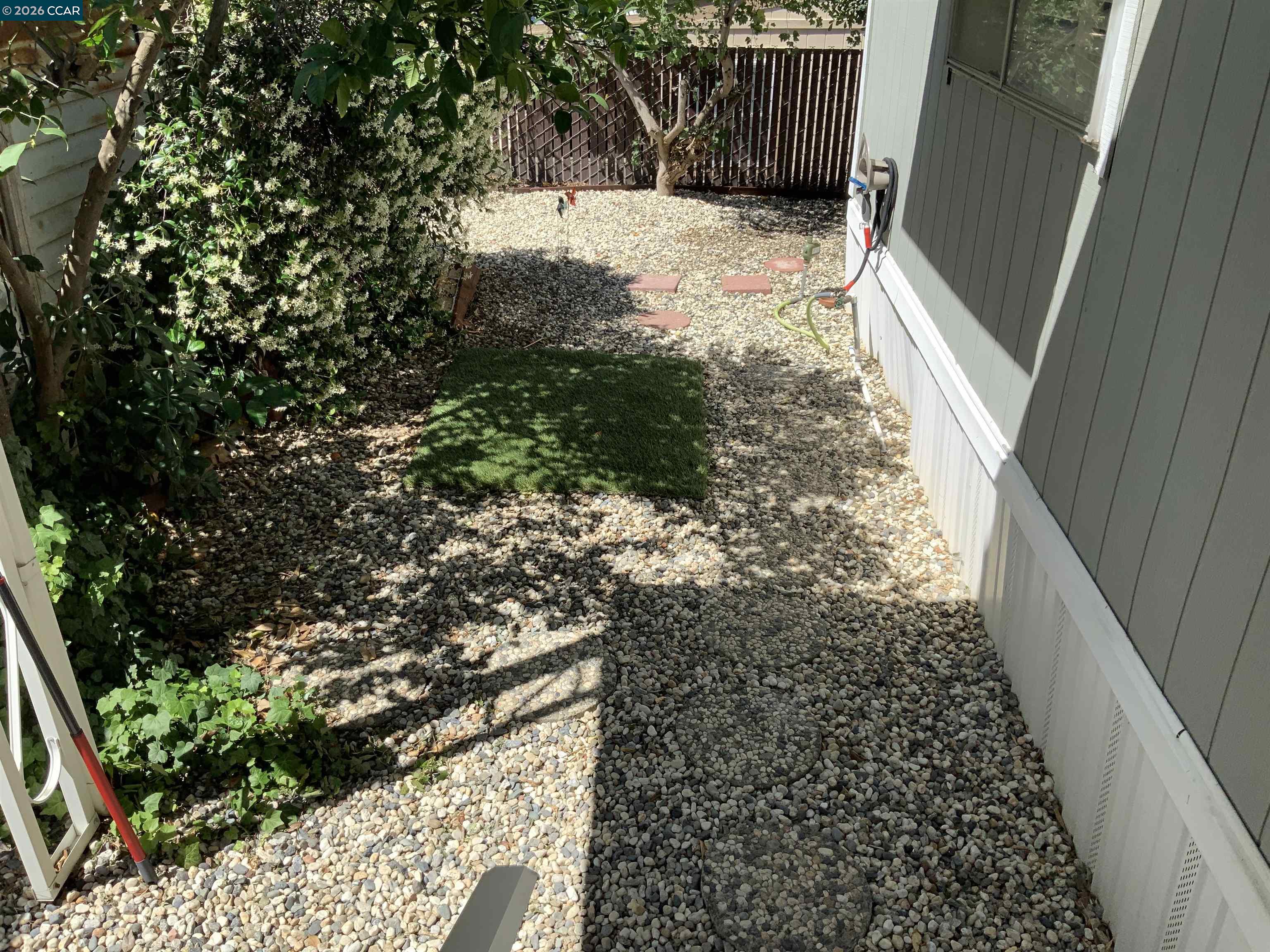 238 Aloha Pittsburg, CA 94565 - Photo 34 of 42 a view of a yard with wooden fence