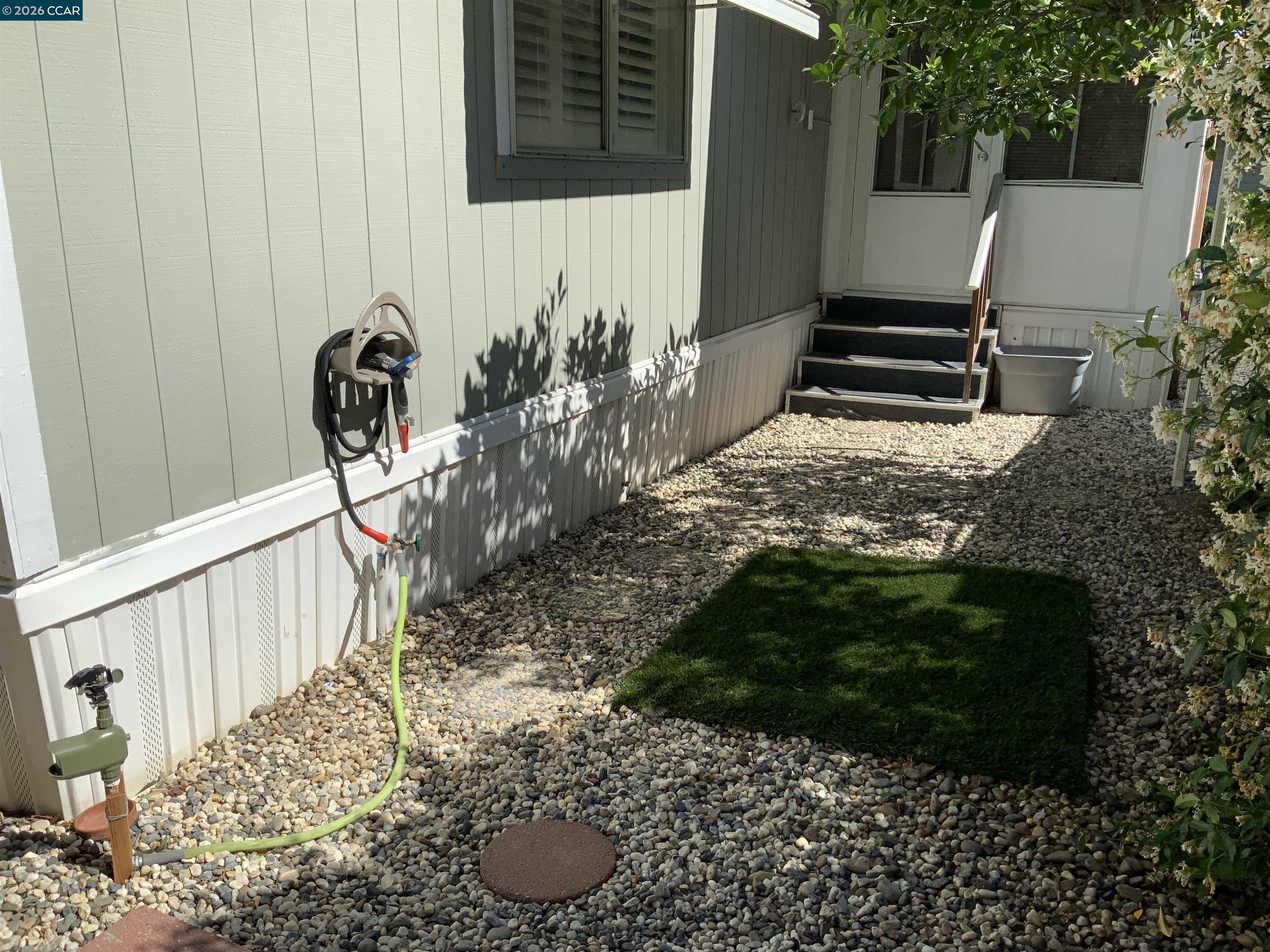 238 Aloha Pittsburg, CA 94565 - Photo 42 of 42 a view of two chairs and table in backyard