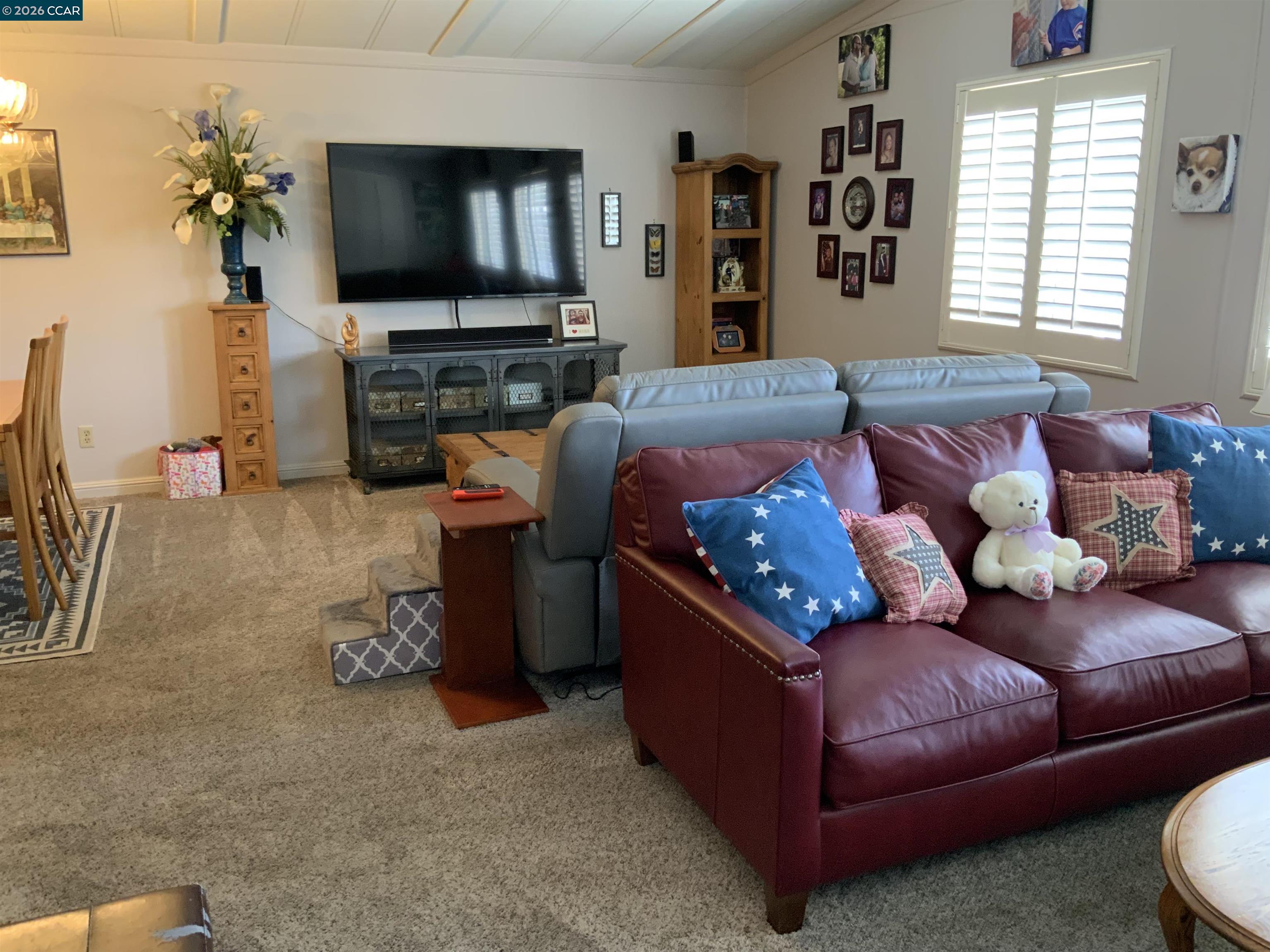 238 Aloha Pittsburg, CA 94565 - Photo 5 of 42 a living room with furniture and a flat screen tv