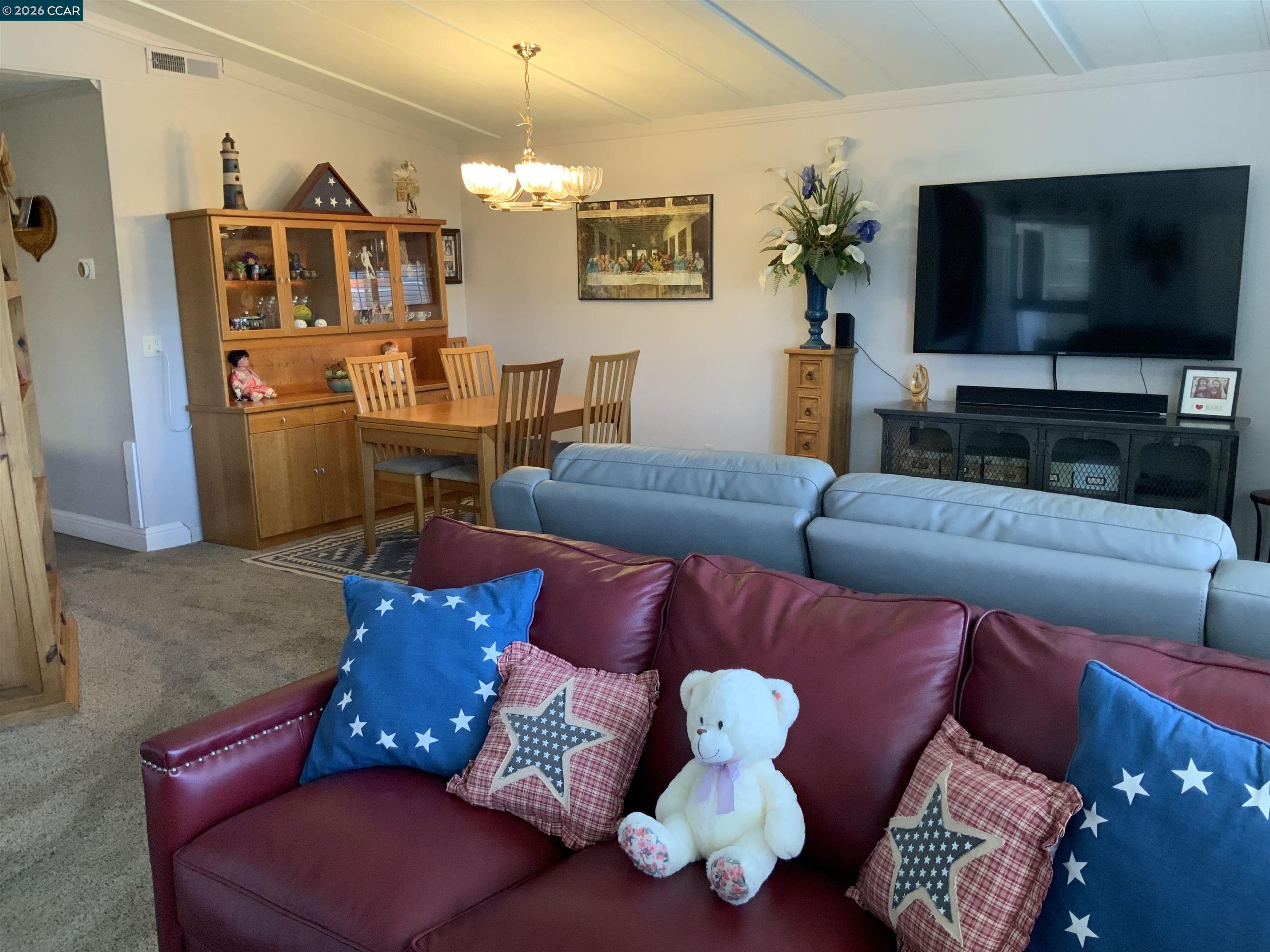 238 Aloha Pittsburg, CA 94565 - Photo 6 of 42 a living room with furniture and a flat screen tv
