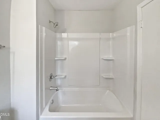 a close view of a bathtub in bathroom