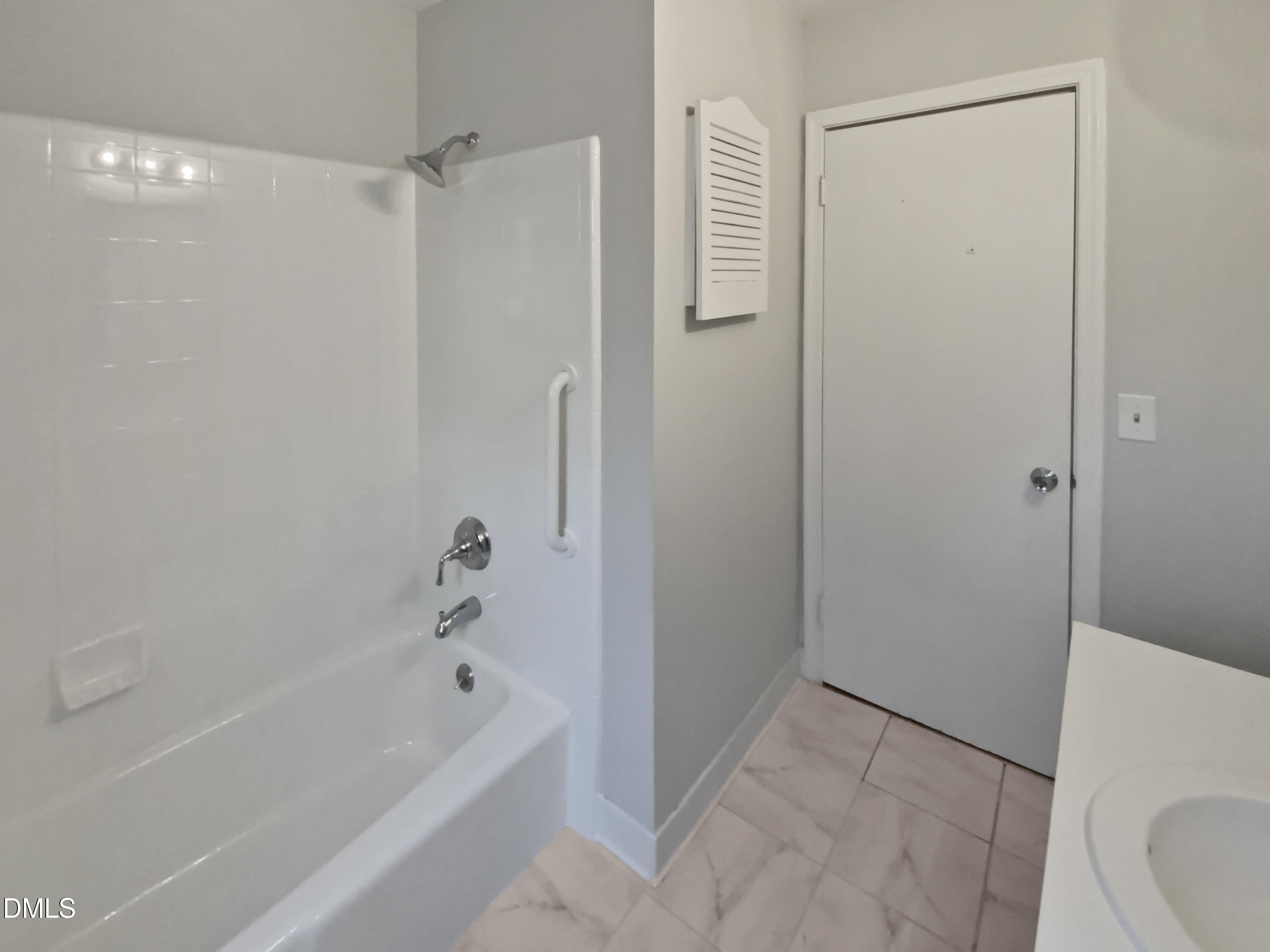 3136 Merrianne Drive Raleigh, NC 27607 - Photo 15 of 20 a bathroom with a bathtub and a shower