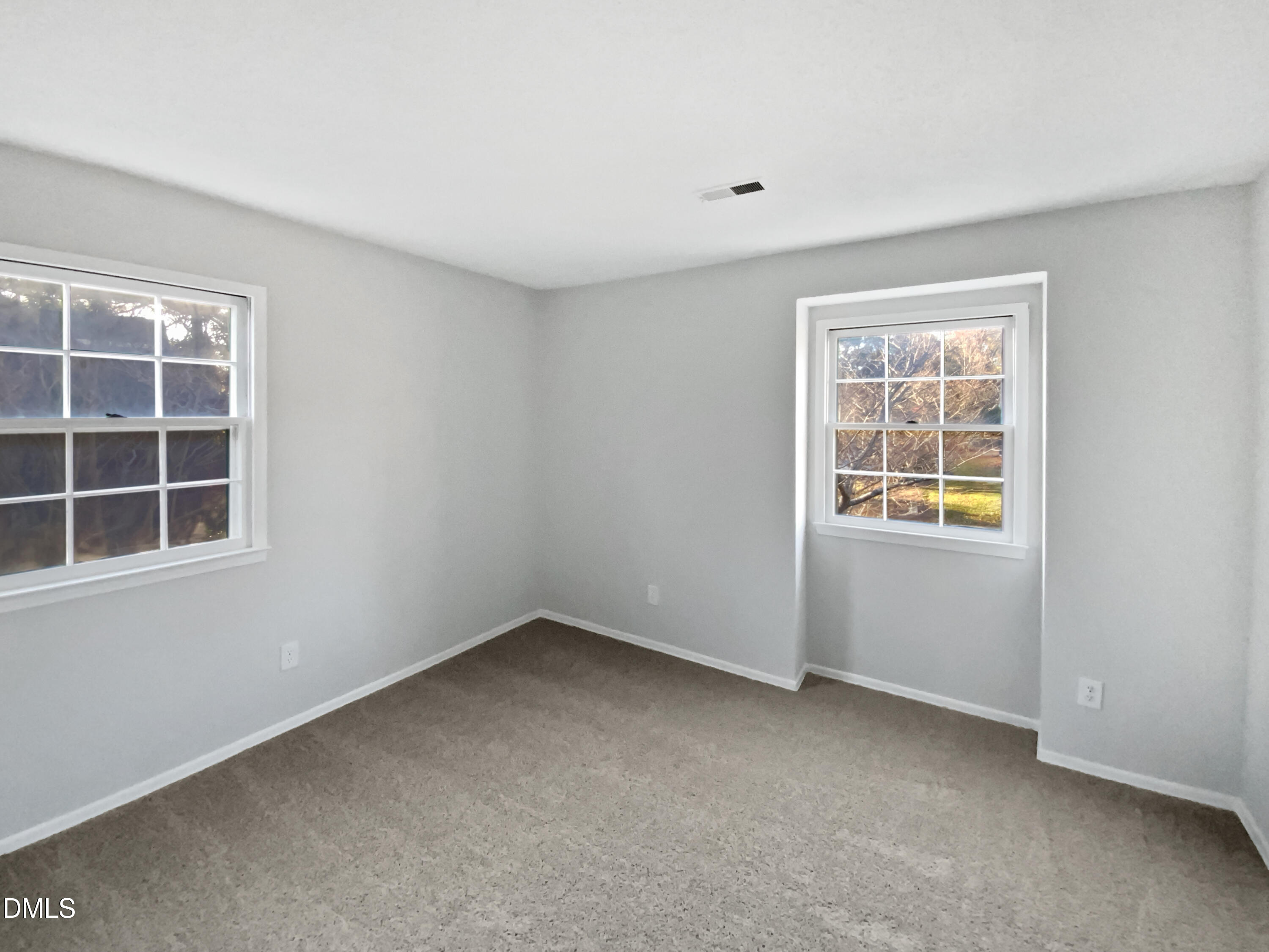 3136 Merrianne Drive Raleigh, NC 27607 - Photo 17 of 20 an empty room with a window