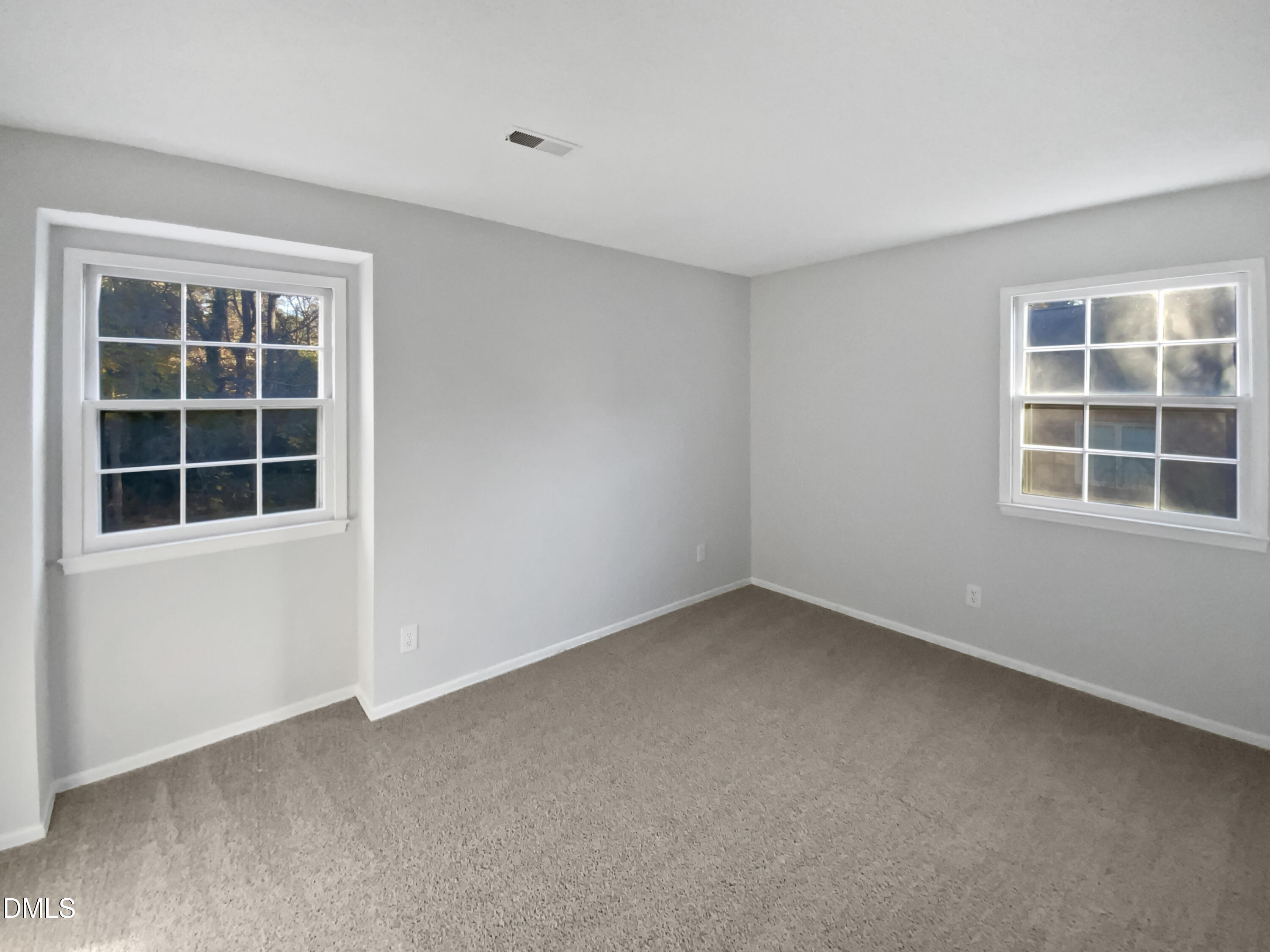 3136 Merrianne Drive Raleigh, NC 27607 - Photo 18 of 20 a view of empty room with windows